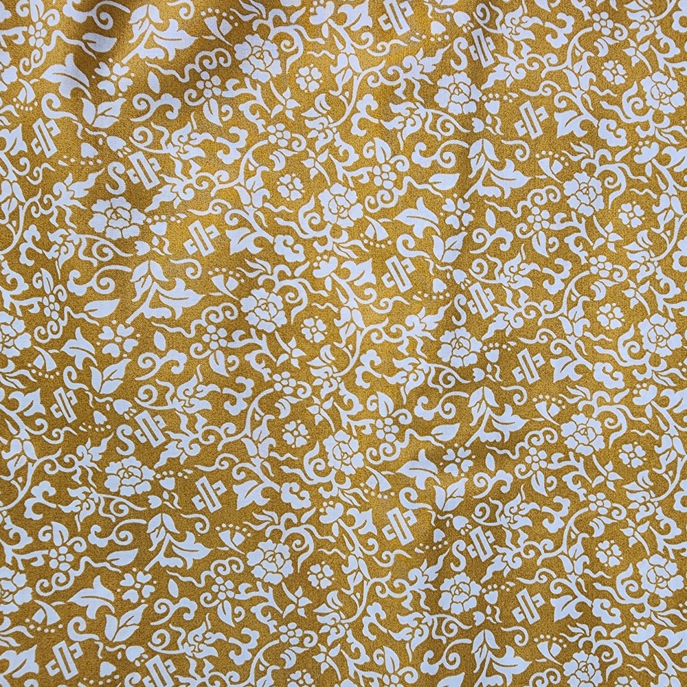 Gold and White Floral Patterned Fabric